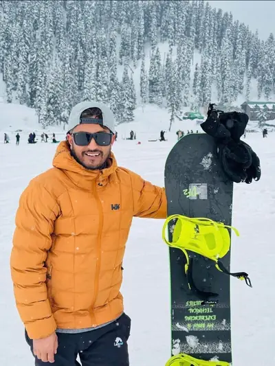 Snowboarder with gear ready for action in snowy Gulmarg